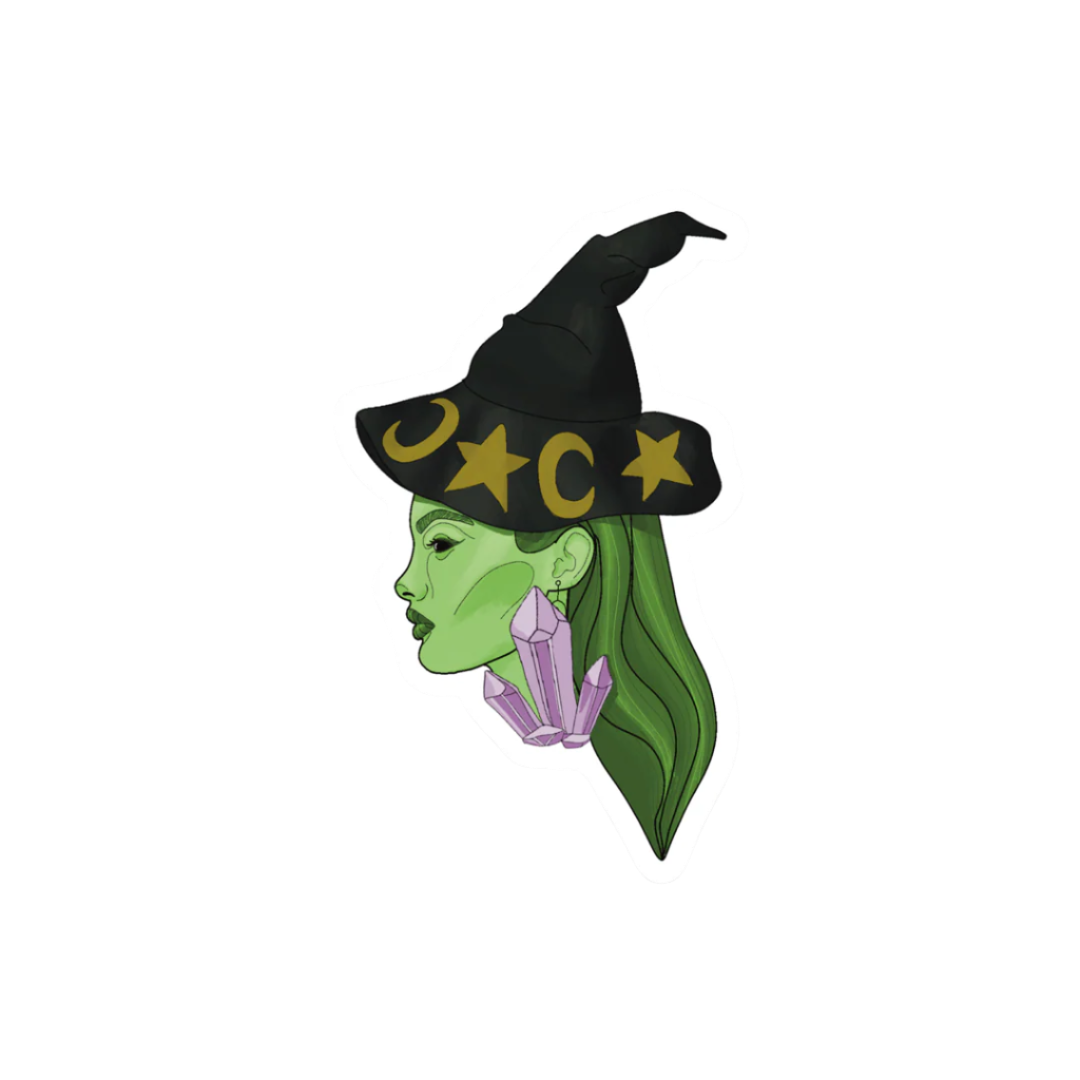 Sticker of a witch with green hair and a black hat featuring stars and a moon on a white background.